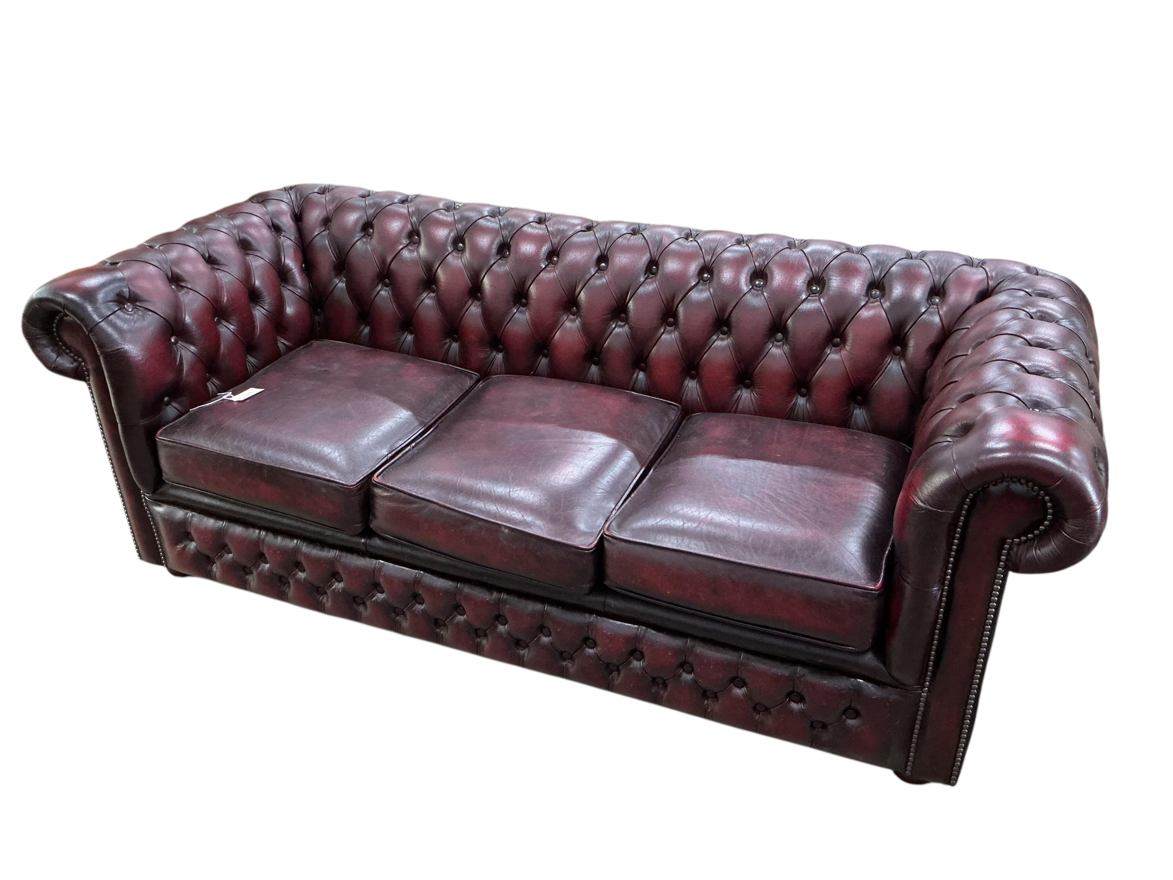 A Victorian style buttoned burgundy leather Chesterfield settee, width 192cm, depth 80cm, height 70cm
